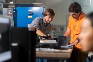 Assistant Professors Haochen Li and Anna Herring and graduate student Christopher Allison prepare for a particle image velocimetry experiment in the Water Infrastructure Lab